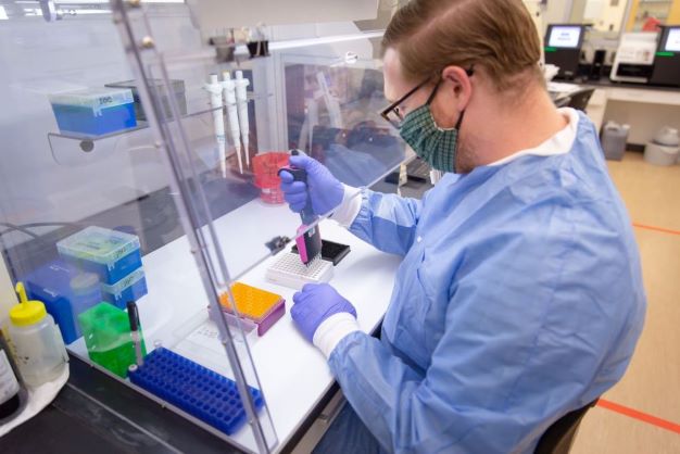 Infectious Disease scientist running a test