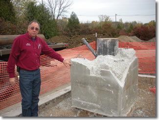 Myron Volker showing water level at Well 4