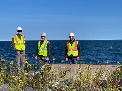 People atop the intake structure on Burlington Bay of Lake Superior