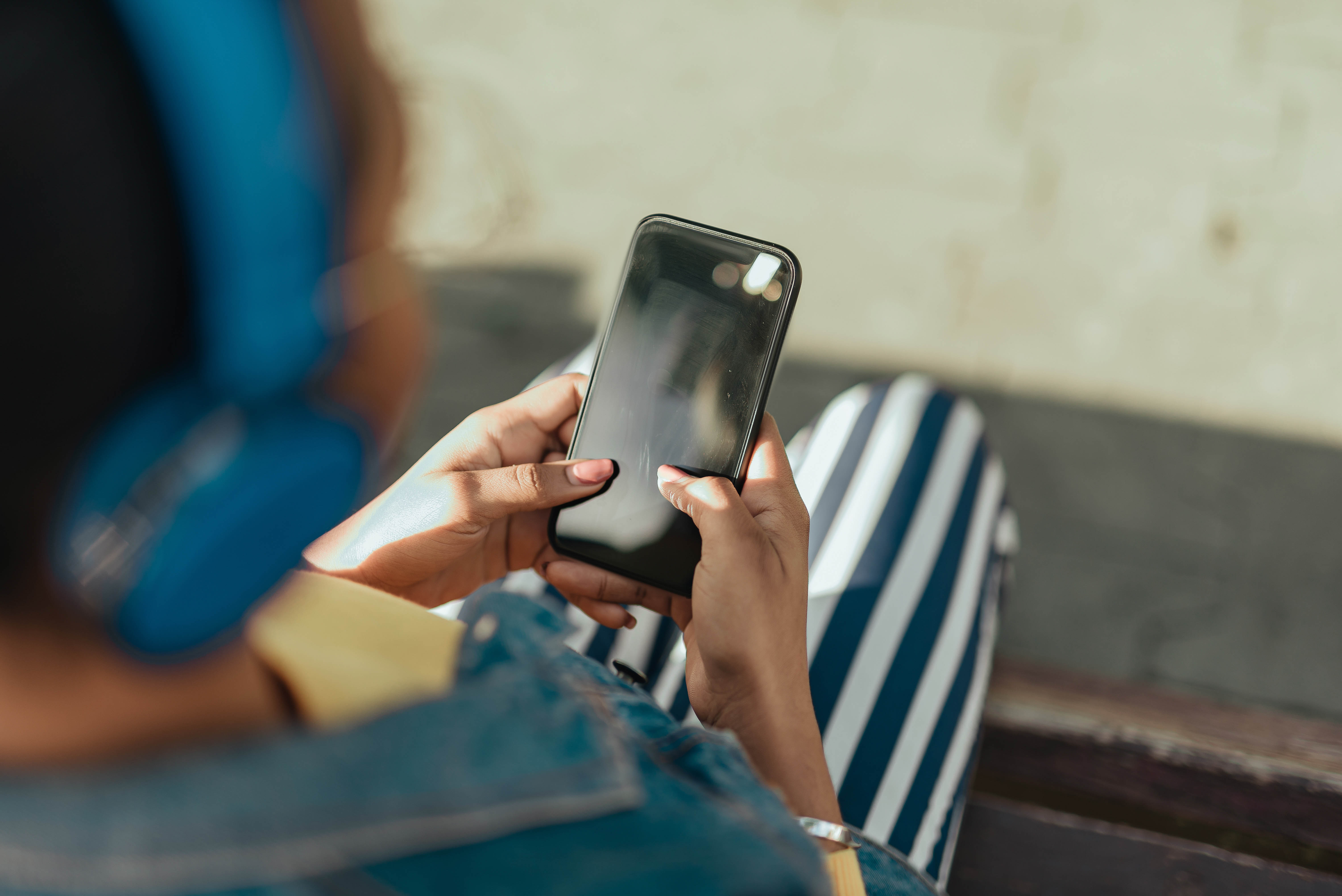 woman reading news on smartsmartphone