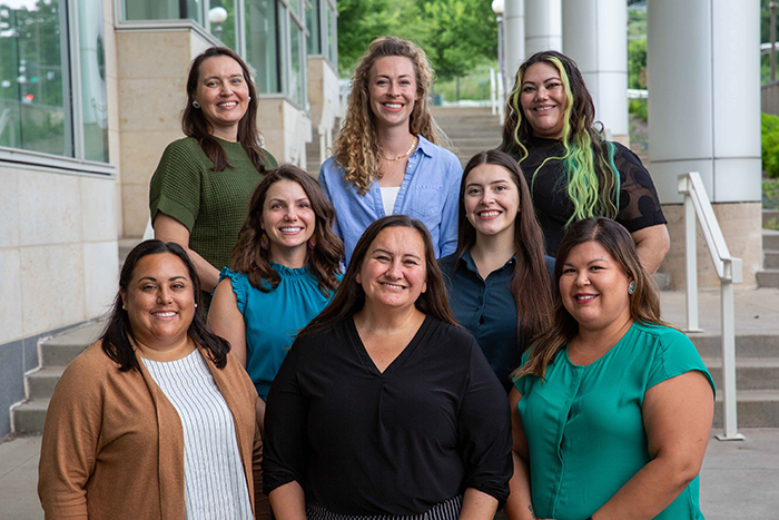 Office of American Indian Health staff smile for a photo outside of the MDH Freeman building