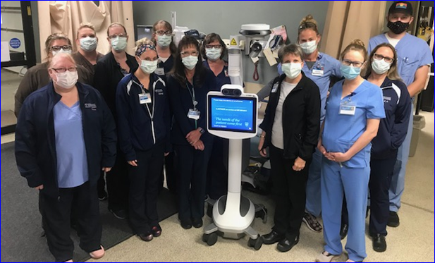 healthcare workers standing inside a hospital with masks on