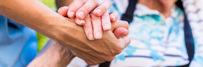 health care worker and patient hands