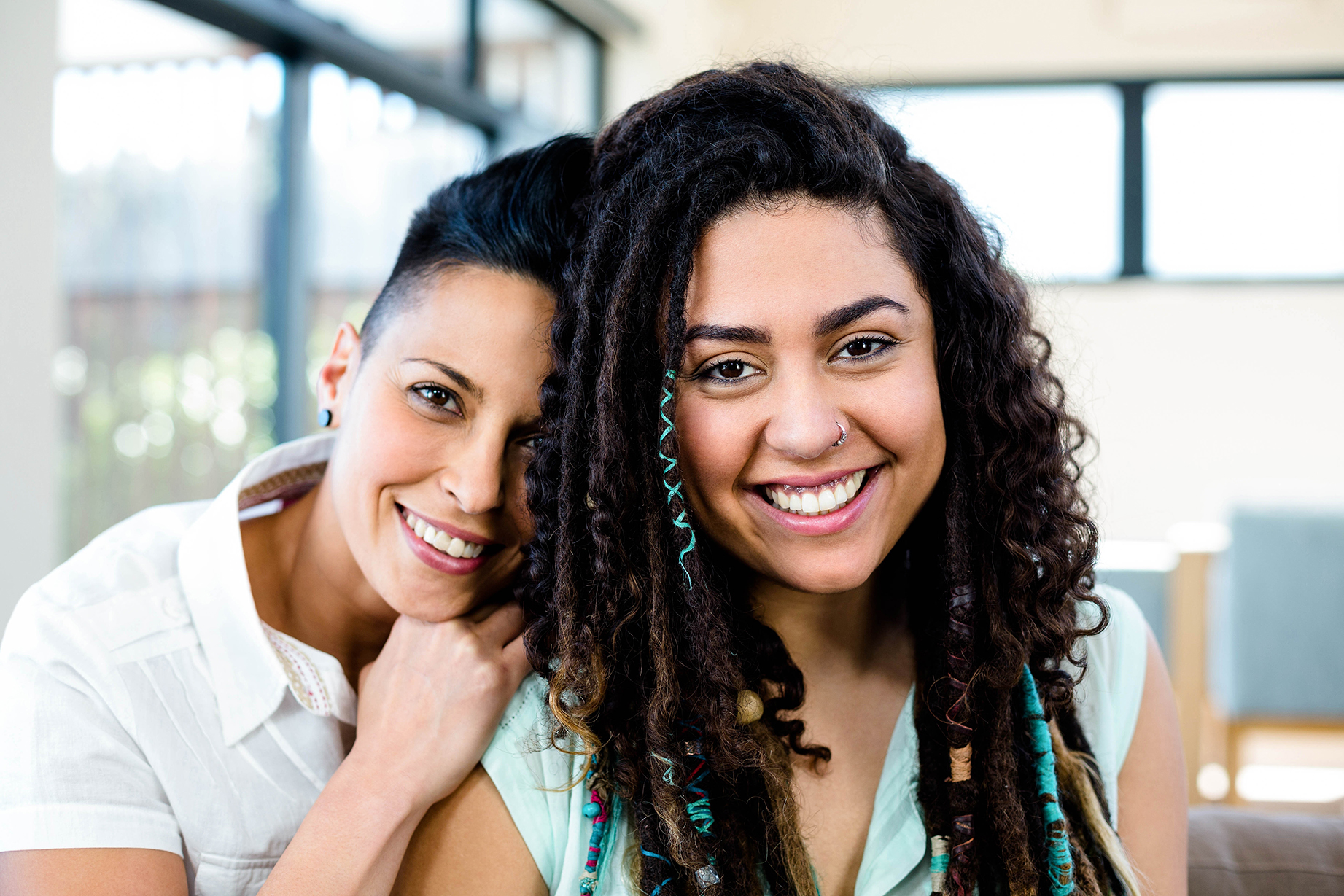 Two women being affectionate.